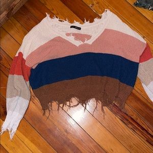 Off the shoulder distressed cropped sweater